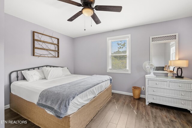 bedroom featuring ceiling fan and dark hardwood / wood-style floors