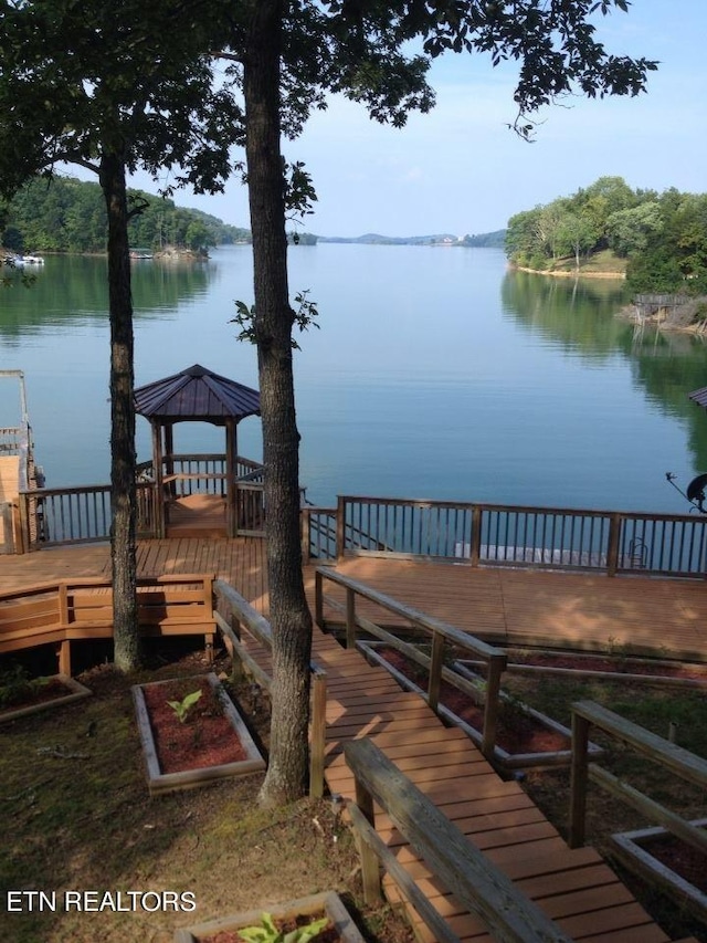 dock area featuring a gazebo and a water view