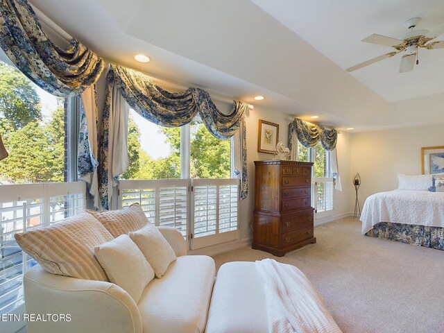 bedroom featuring light colored carpet and ceiling fan