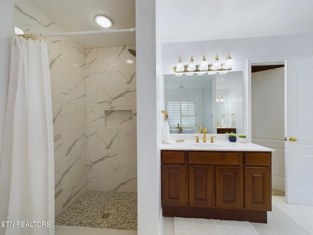 bathroom with vanity and walk in shower