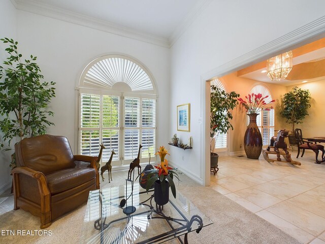 tiled living room featuring crown molding and an inviting chandelier