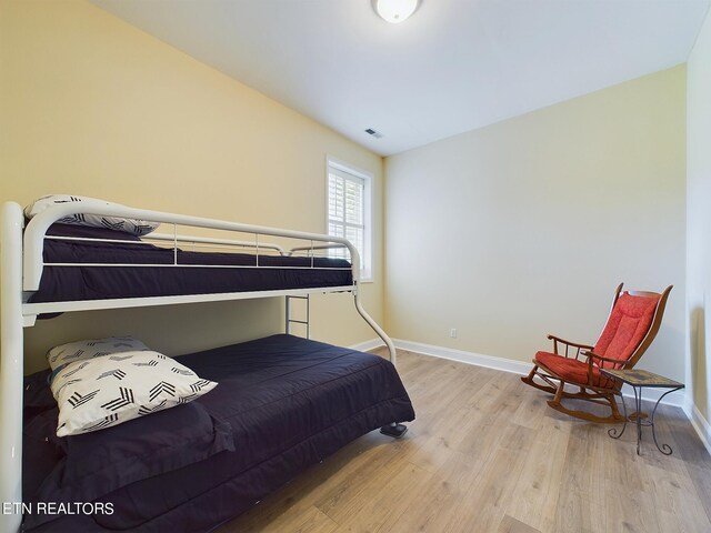 bedroom with wood-type flooring