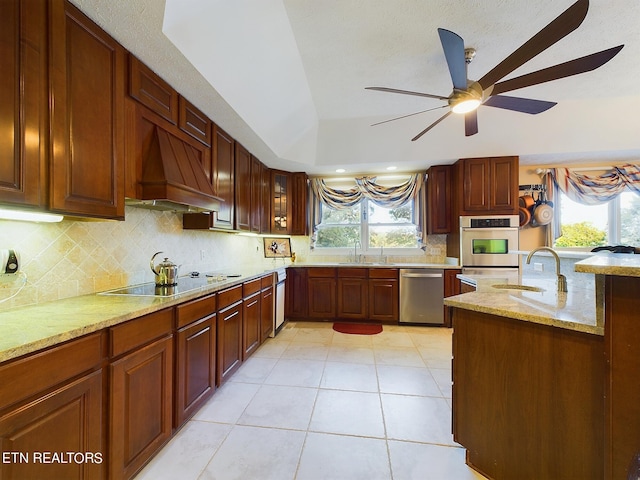 155 Lake Crest Dr, Lenoir City, TN 37772 - kitchen featuring tasteful backsplash, stainless steel appliances, a sink, ceiling fan, and custom exhaust hood