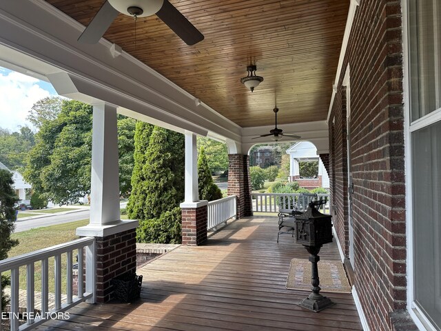 deck with ceiling fan and a porch