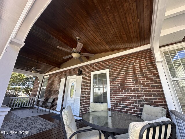 wooden terrace featuring ceiling fan