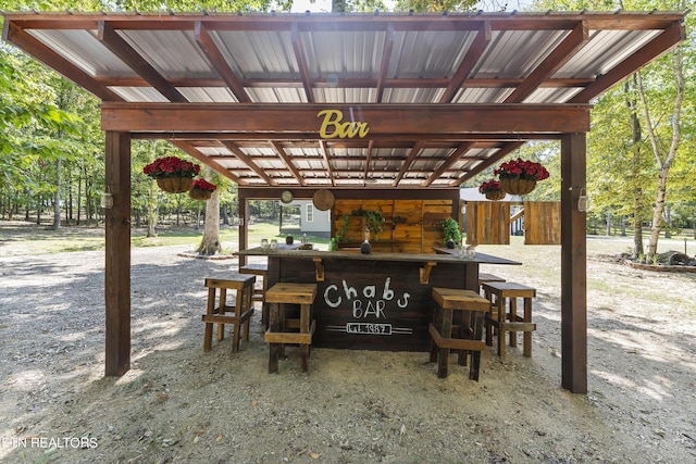 view of patio / terrace featuring an outdoor bar