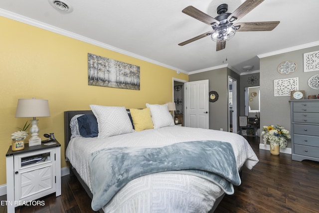 bedroom featuring ceiling fan, crown molding, and dark wood-type flooring