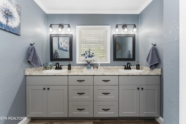 bathroom featuring vanity and crown molding