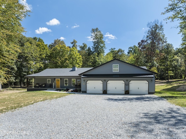 ranch-style home with a front lawn and a garage