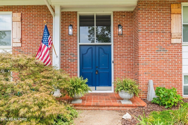 doorway to property with a porch