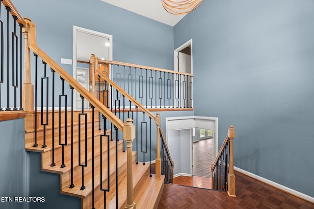 staircase with parquet flooring