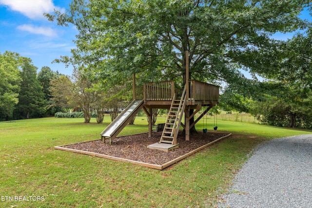 view of jungle gym with a lawn