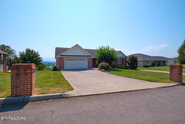 ranch-style home featuring a garage and a front lawn