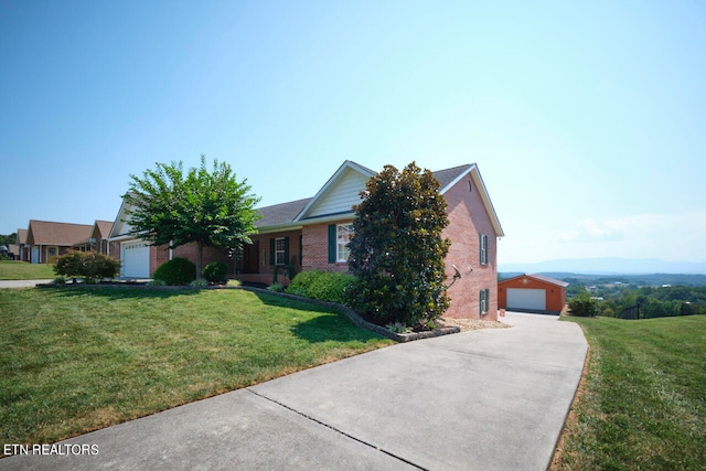 view of front of house with a garage and a front lawn