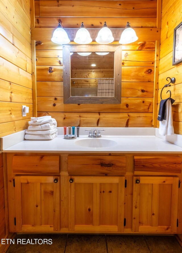 bathroom with wooden walls and vanity