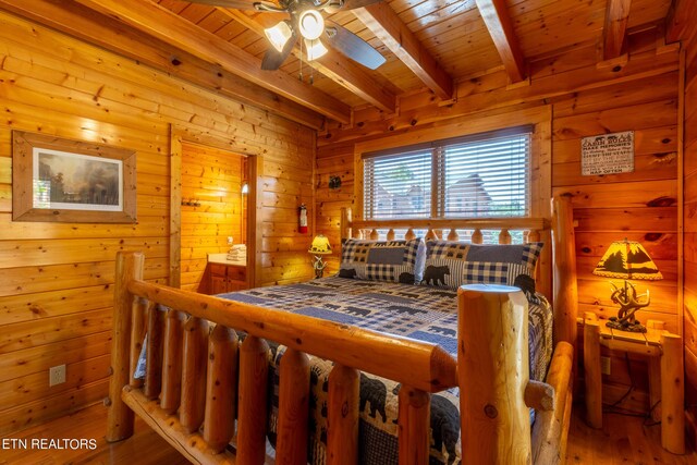 bedroom with wood walls, wood-type flooring, wood ceiling, and beamed ceiling