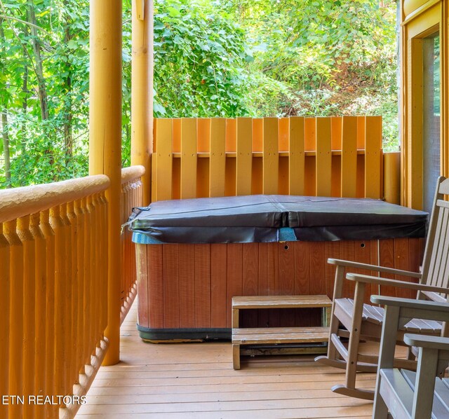 deck with a hot tub