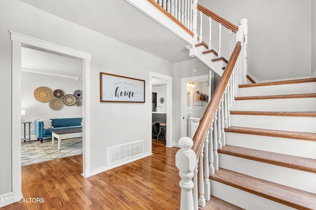 stairway featuring hardwood / wood-style floors