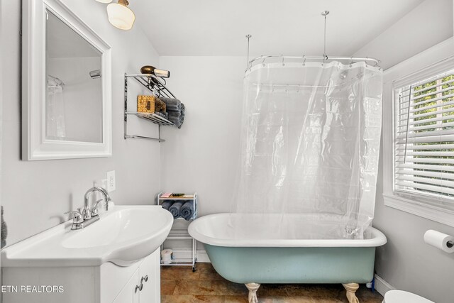 bathroom with vanity and separate shower and tub