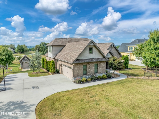 craftsman inspired home with a garage and a front lawn