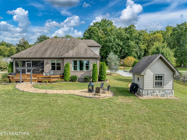 exterior space with a lawn and an outdoor structure