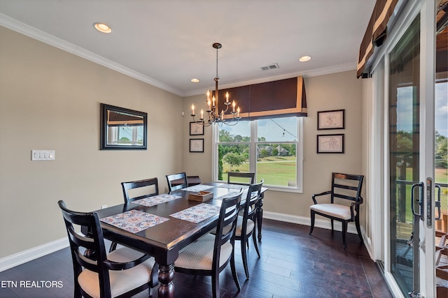 dining area featuring an inviting chandelier, dark hardwood / wood-style flooring, and ornamental molding