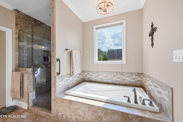 bathroom featuring shower with separate bathtub, a notable chandelier, and ornamental molding