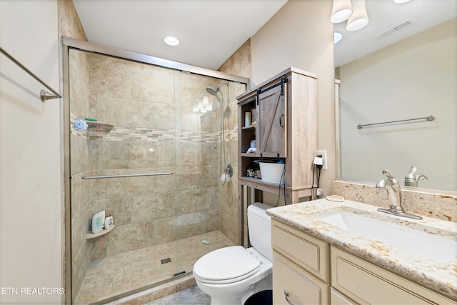 bathroom featuring walk in shower, toilet, and vanity