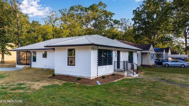 view of front of home with a front yard