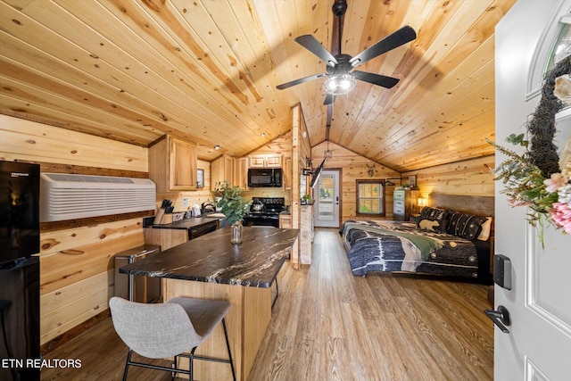 interior space featuring wood-type flooring, wooden walls, vaulted ceiling, and wooden ceiling