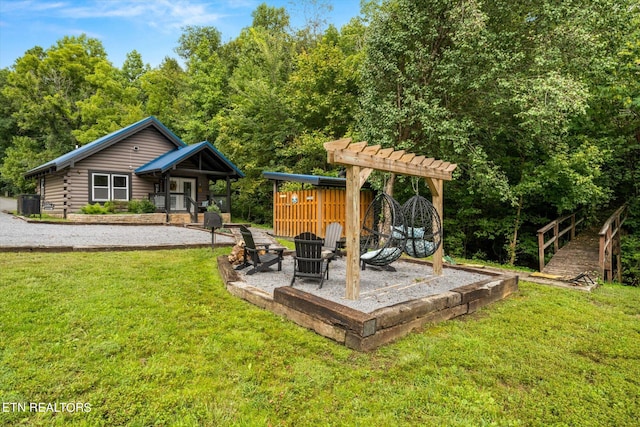 view of yard with a fire pit and a patio area