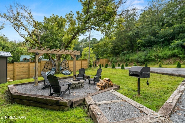 view of patio featuring area for grilling and a fire pit