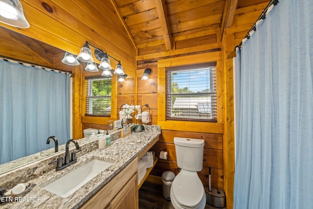 bathroom with vanity, wood ceiling, wooden walls, lofted ceiling with beams, and toilet