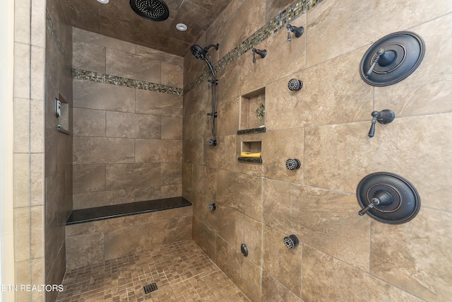 bathroom featuring a tile shower