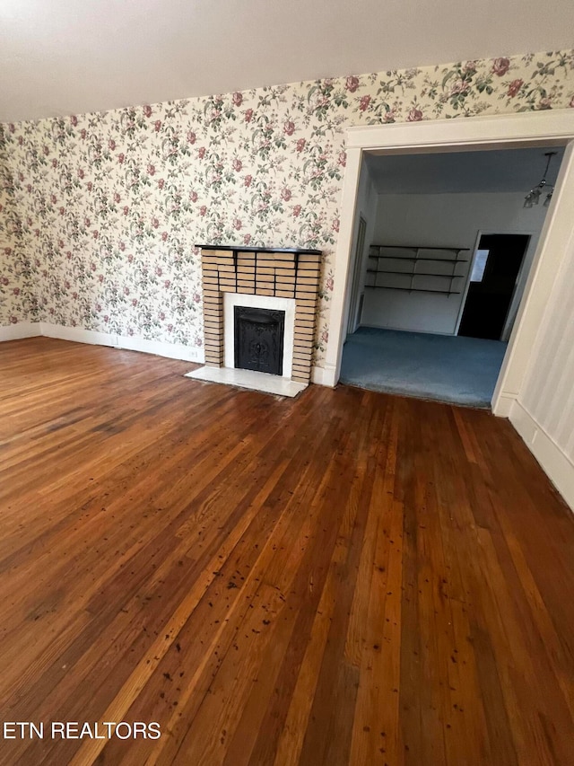 unfurnished living room with hardwood / wood-style flooring