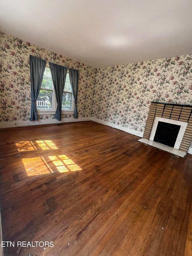 unfurnished living room with wood-type flooring