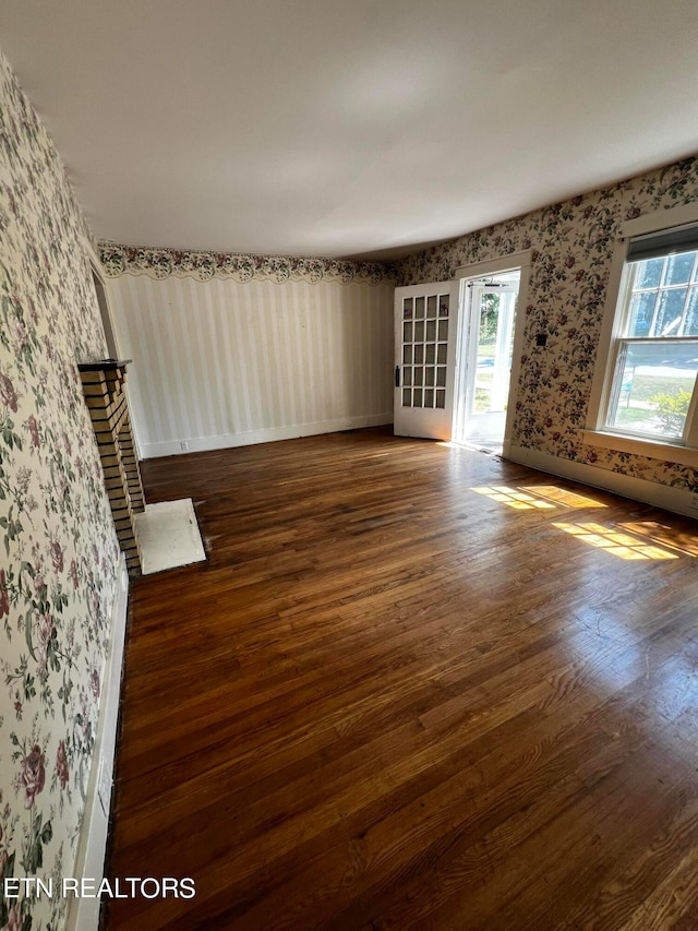 spare room featuring dark hardwood / wood-style flooring