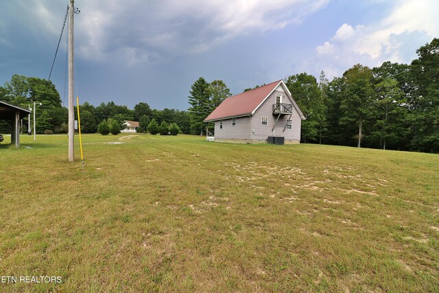 view of yard with central AC