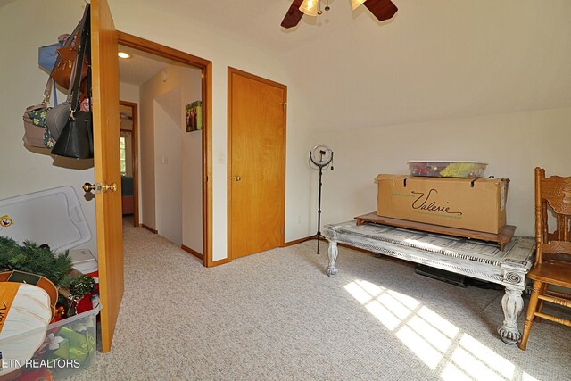 carpeted bedroom featuring lofted ceiling and ceiling fan