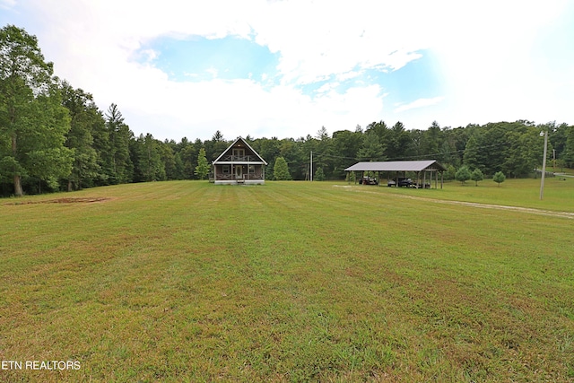 view of yard with a forest view