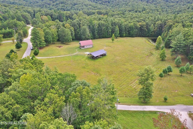 aerial view featuring a rural view and a forest view