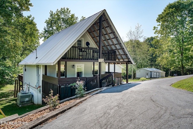 view of front facade featuring covered porch and cooling unit