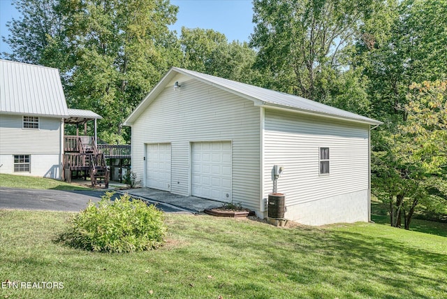 garage with a yard