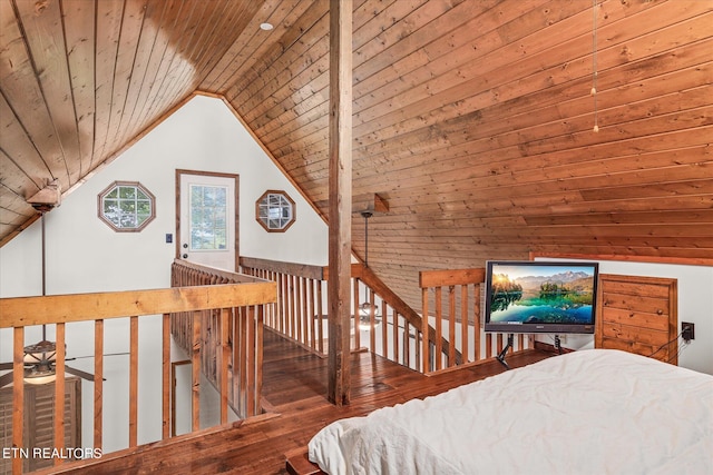 bedroom featuring wood walls, vaulted ceiling, wood-type flooring, and wooden ceiling