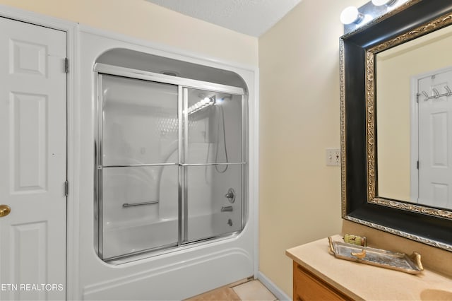 bathroom with shower / bath combination with glass door, a textured ceiling, and tile patterned floors