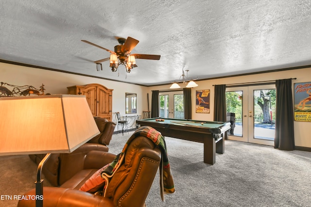 recreation room with french doors, a textured ceiling, ceiling fan, carpet floors, and pool table