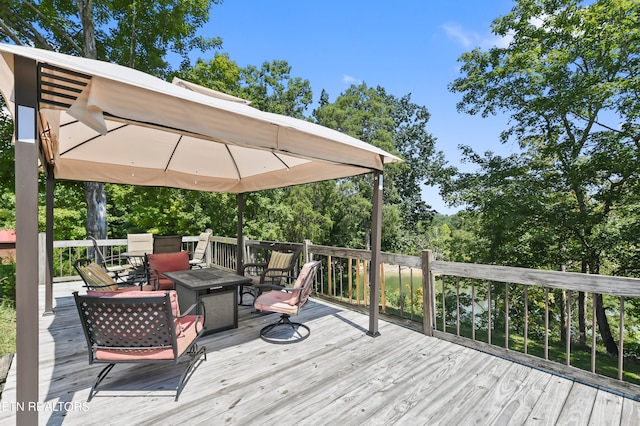 deck with an outdoor fire pit