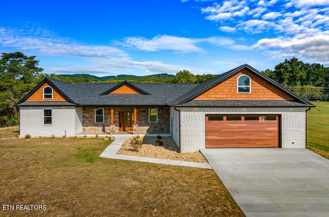 view of front facade featuring a garage and a front lawn