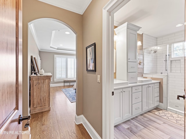 interior space featuring a wealth of natural light, hardwood / wood-style floors, and a shower with shower door