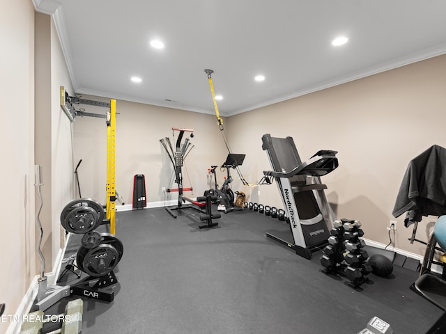 workout room with ornamental molding